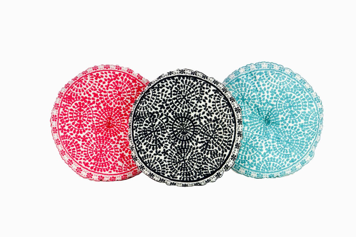 Coral, black and turquoise embroidered round cushions