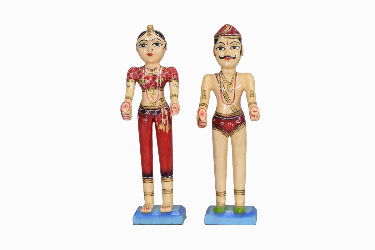 2 red wooden indian figurines