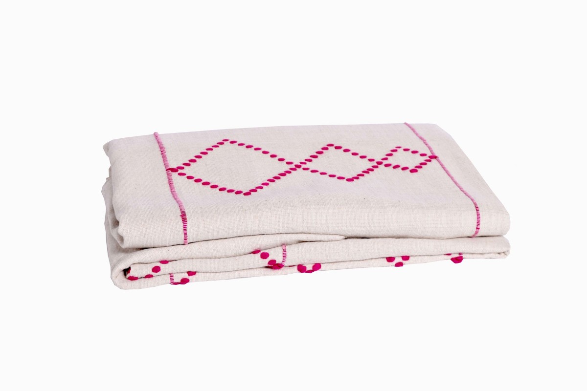Moroccan pink and crean diamond bedspread folded 1