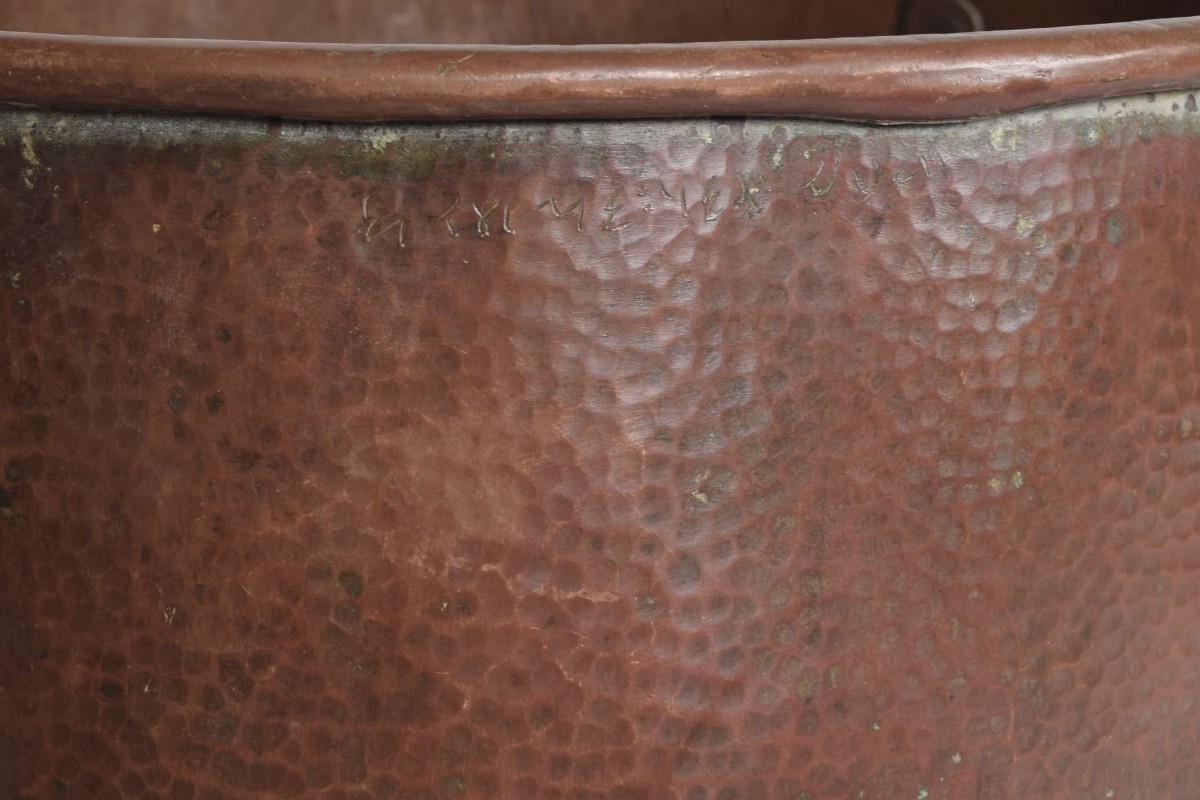 Large deep copper pot close up view