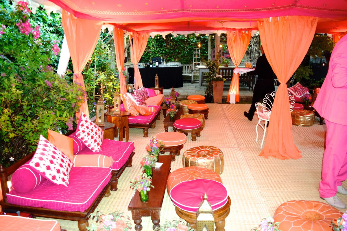 Orange and pink double Metal Frame Raj Tent in a London garden