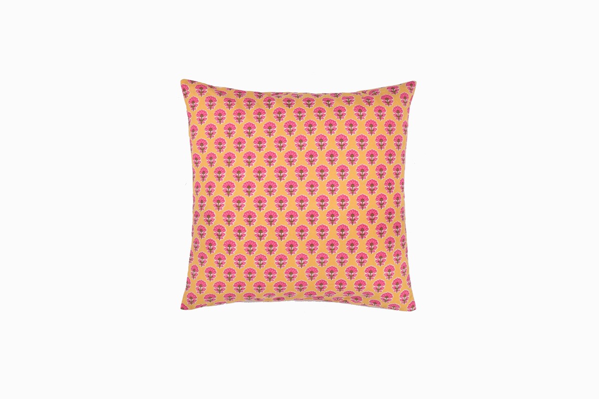 Pink marigold on yellow cushion