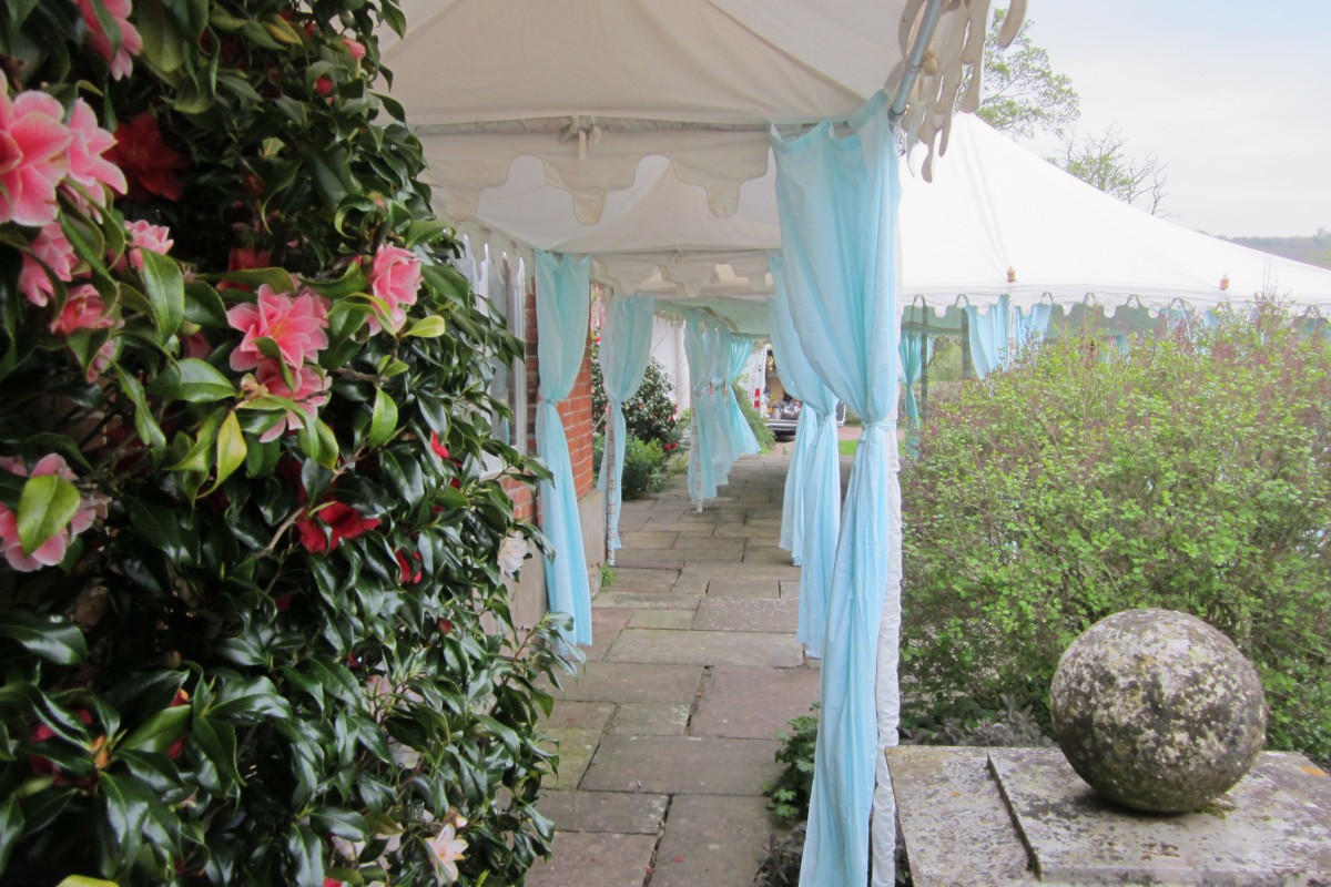 A walkway with dove egg drapes