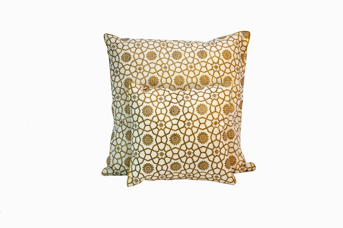 Cream cushions with gold geometric flowers