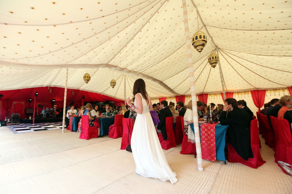The bride checking all is OK in her Quadruple Maharaja wedding tent