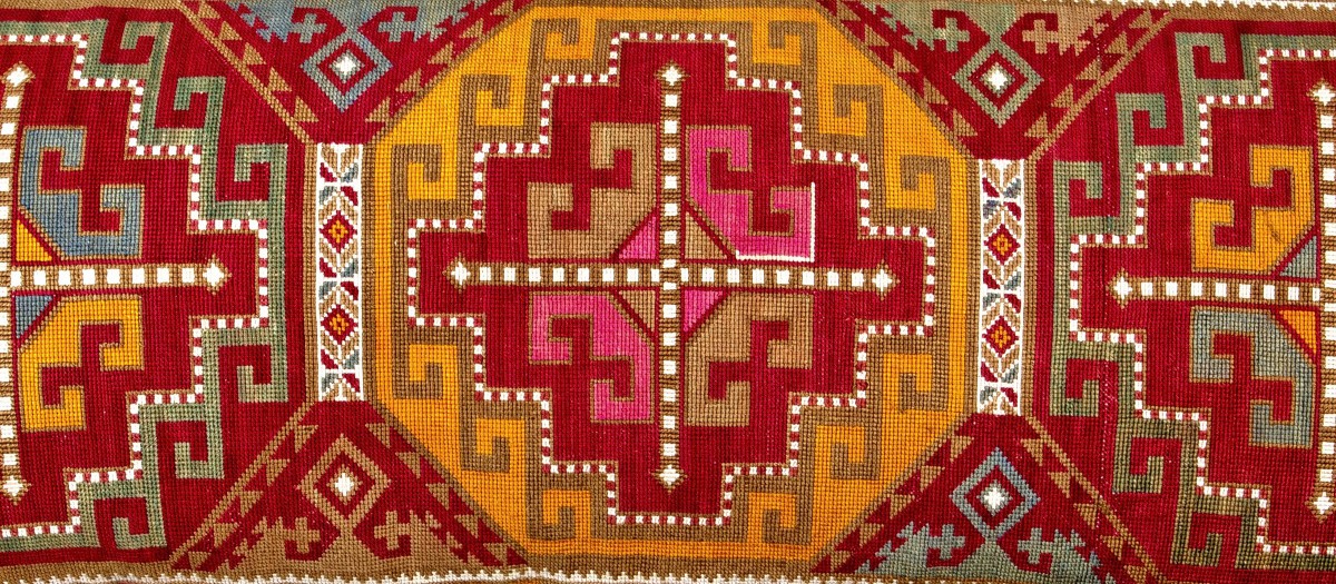 Header shot embroidered cushion
