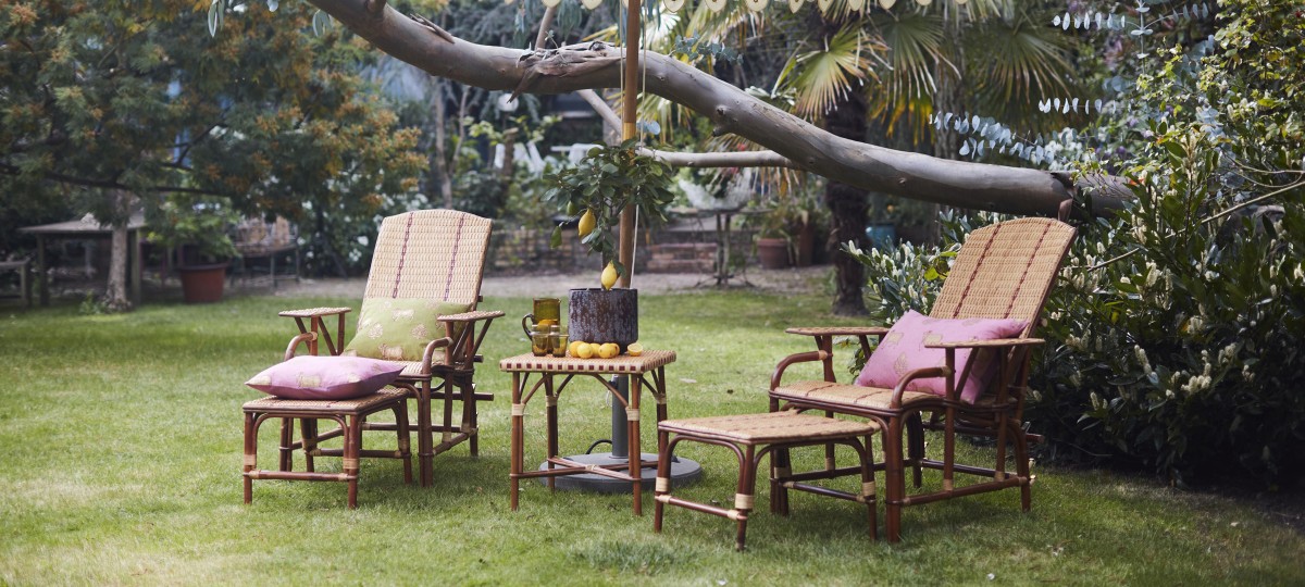 2 cane garden chairs and table