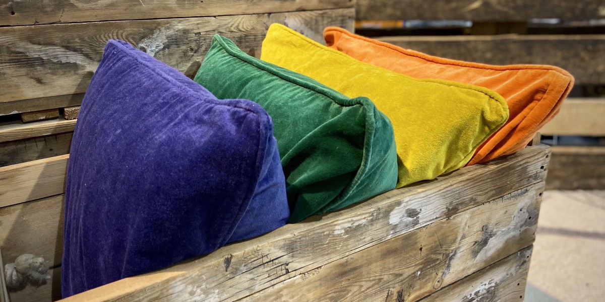 blue, green, yellow & orange coloured velvet cushions