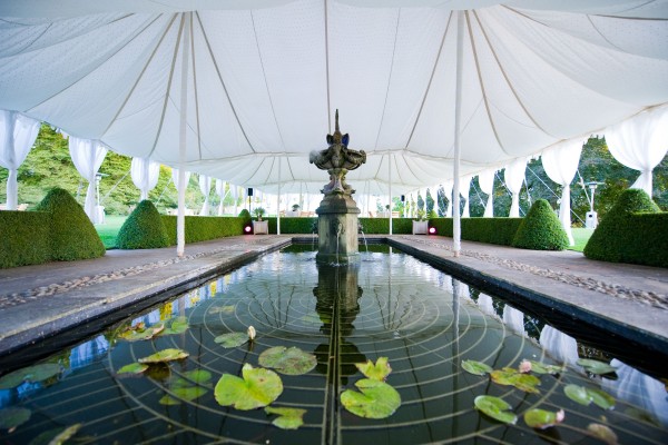 Triple Maharaja reception tent over a pond