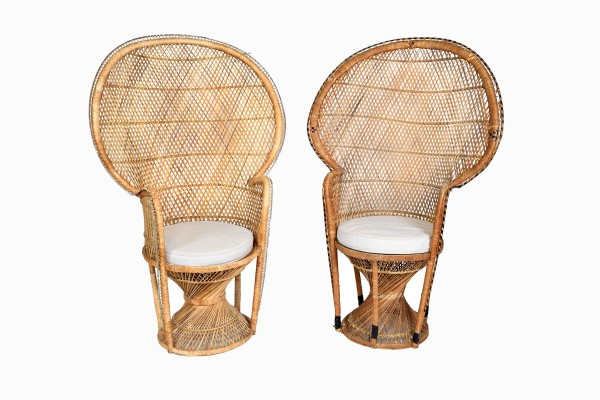 A pair of vintage rattan peacock chairs