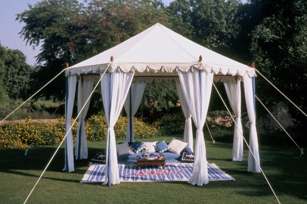 4m Pavilion with floor cushions in a garden