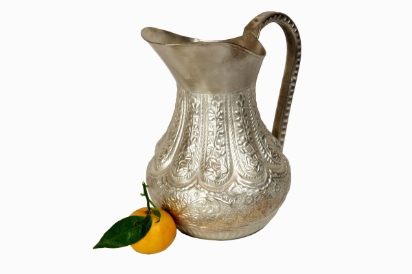 Embossed metal jug