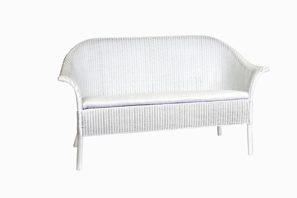 White wicker three seater sofa