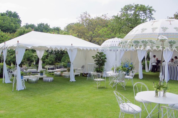 A metal frame Raj Tent at a garden party in Southern England