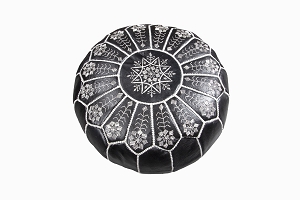 Black leather pouffe with white embroidery