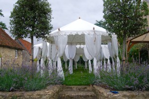 4m Pavilion with cream gold star ceiling in a garden