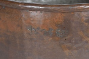 Large copper cooking pot close up