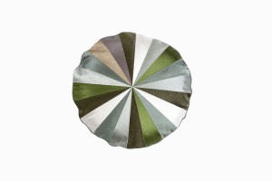 Round segmented and embroidered cushion greens