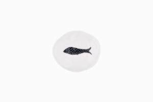 Tiny porcelain dish with a black fish