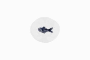 Tiny porcelain dish with a fat grey fish