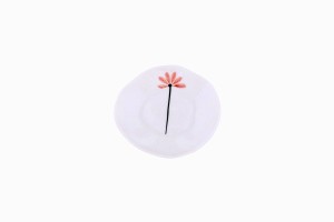 Tiny porcelain dish with a very small red flower