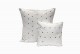 White on white jalli cushions with silver sequins